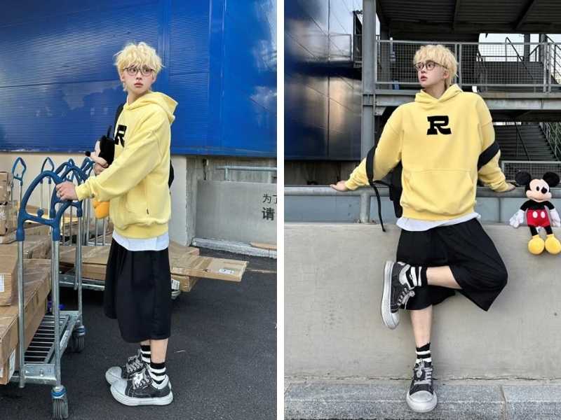 Phối quần short đen với hoodie nam màu vàng